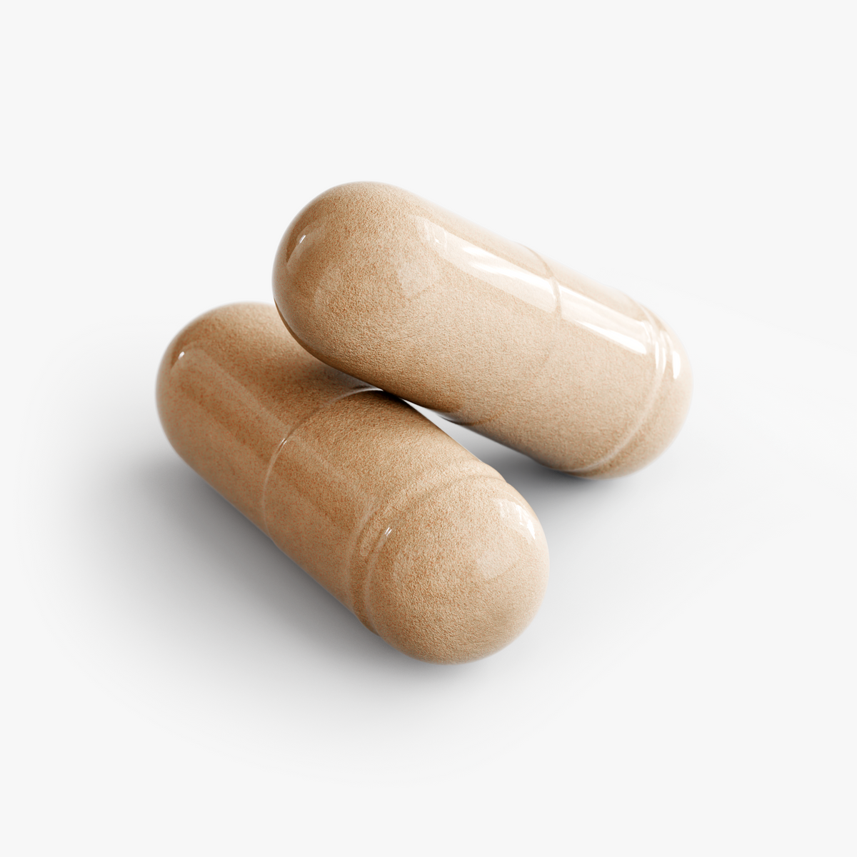 Close-up of two 10X Mushroom Complex capsules